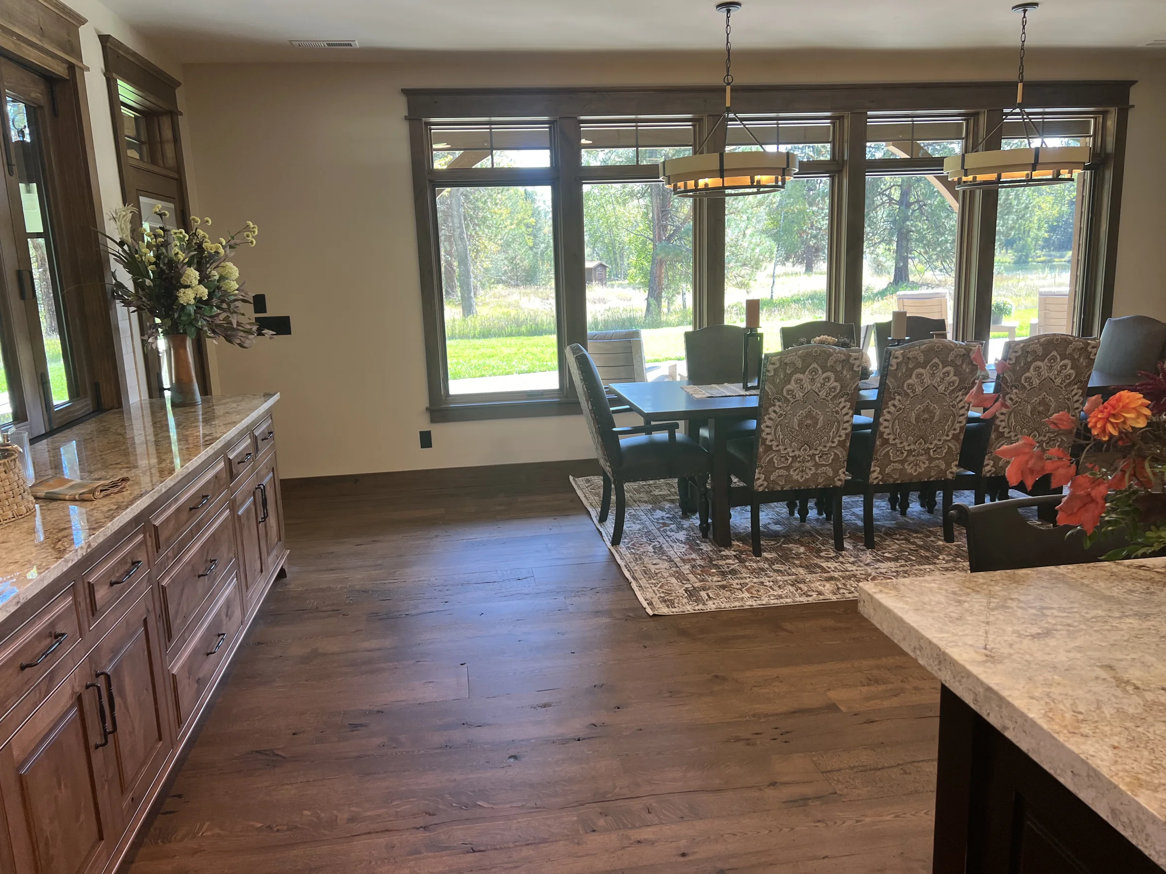 Dining room with custom hardwood floor in a featured Winnwood Flooring project